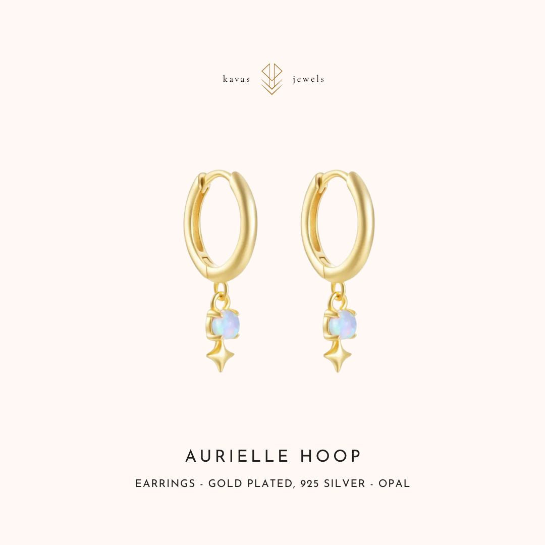 Gold hoop earrings with opal stones on a white background, branded 'kavas jewels'.